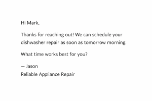 Appliance repair technician typing a fast response to a customer lead on a laptop.