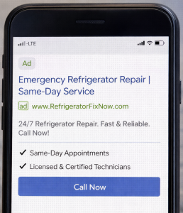 Example of a high-converting mobile text ad for emergency refrigerator repair services.