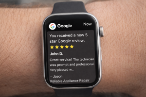 Five-star Google Business Profile review notification on a smart watch.